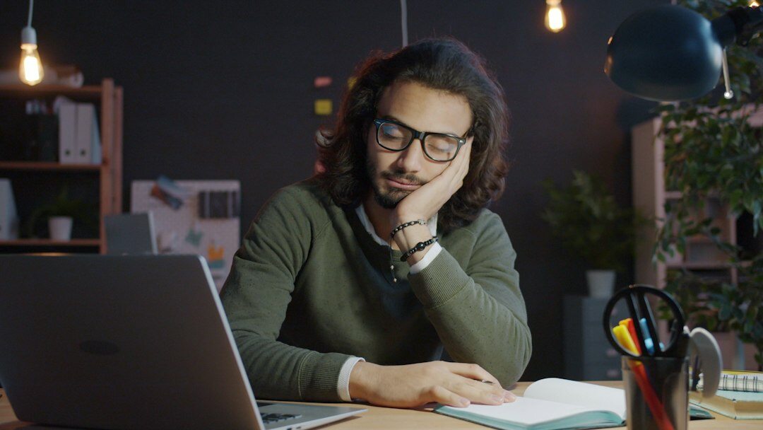 writer at desk with notebook
