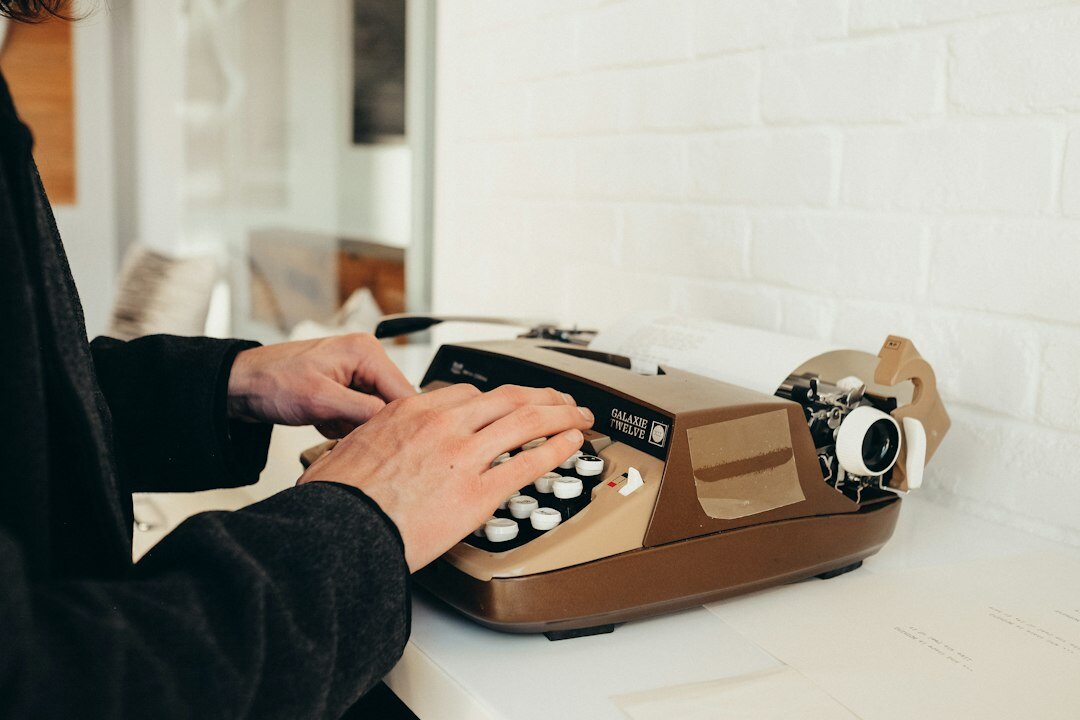 writer typing on typewriter